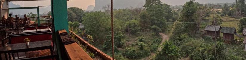 Blue Sunset Guesthouse riverside view with mountains