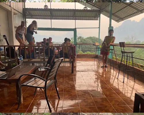 Peaceful riverside seating at Blue Sunset Guesthouse